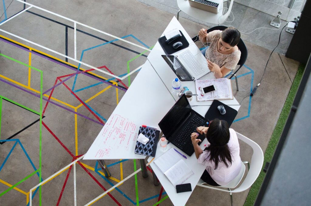 The Importance of Networking and Mentorship - two women talking in a table